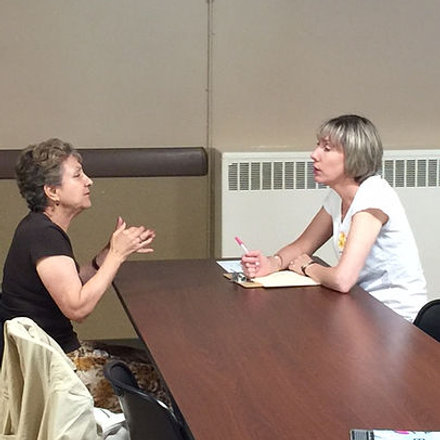 Advisor meeting with an older adult to discuss long-term care and future planning.