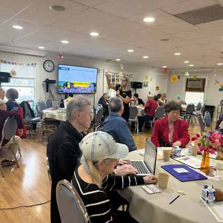 Community members attending an educational seminar about dementia and Alzheimer’s care.