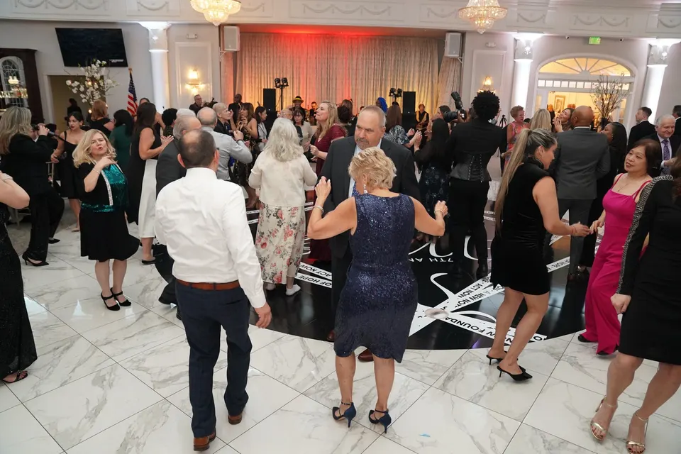 Gala guests dancing on the ballroom floor at the Music & Memories Gala